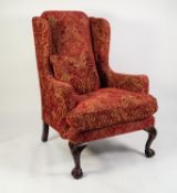 GEORGE III STYLE LARGE WINGED FIRESIDE ARMCHAIR, upholstered and coverd in embossed wine red and