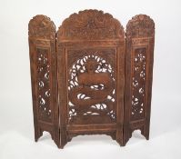 CHINESE CARVED AND PIERCED HARDWOOD LARGE TRIPTYCH GRATE SCREEN, with triple arched top, the