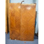 FRENCH OAK CARCASE AND QUARTER VENEERED KINGWOOD ARMOIRE, the flat top above a pair of long doors