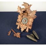 POST WAR SWISS CARVED SOFT WOOD CUCKOO WALL CLOCK, of chalet form with pine cone pattern weights