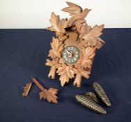 POST WAR SWISS CARVED SOFT WOOD CUCKOO WALL CLOCK, of chalet form with pine cone pattern weights