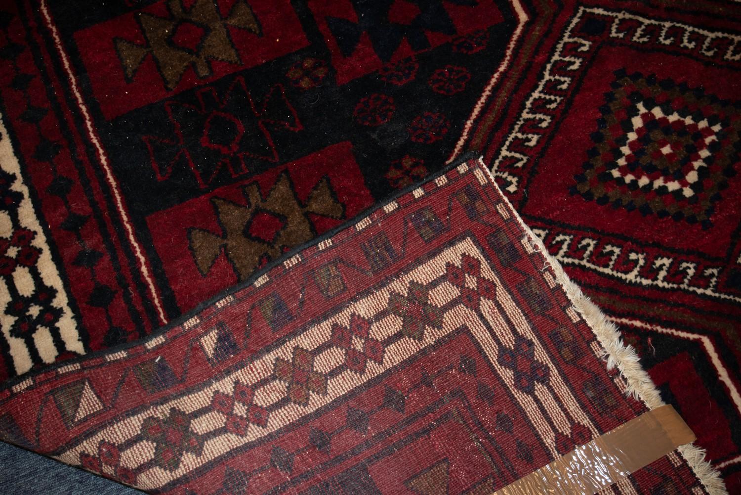 EASTERN CARPET with three diamond pole medallions, on a tile pattern field, the colour predominantly - Image 3 of 3