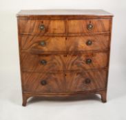 EARLY NINETEENTH CENTURY FIGURED MAHOGANY BOW FRONTED CHEST OF DRAWERS, the shaped top with