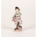A SMALL EARLY TWENTIETH CENTURY GERMAN, PORCELAIN FIGURE  of a boy in tri-corn hat and floral