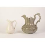 A VICTORIAN STAFFORDSHIRE MOULDED GREY POTTERY JUG, in relief with two opposing Bacchanalian