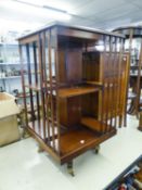 A MAHOGANY REVOLVING BOOKCASE