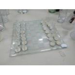 A GLASS STAUNTON PATTERN CHESS SET, WITH PLAIN AND FROSTED GLASS CHESS PIECES, UPTO 2 1/4" (6cm)