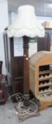 A CARVED MAHOGANY HEAVY STANDARD LAMP WITH TAPERED OCTAGONAL COLUMN AND SQUARE BASE AND THE WHITE