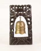 CHINESE HEAVY EMBOSSED BRASS BELL/DINNER GONG, 7 1/4in (18.4cm) high, suspended in a carved and