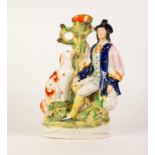 A VICTORIAN STAFFORDSHIRE POTTERY FLAT BACK FIGURAL SPILL HOLDER, with a man seated beside his
