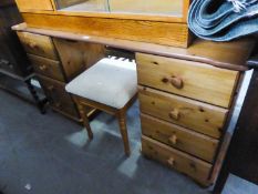 A MODERN PINE DOUBLE PEDESTAL DRESSING TABLE WITH EIGHT DRAWERS AND THE PINE DRESSING STOOL (2)