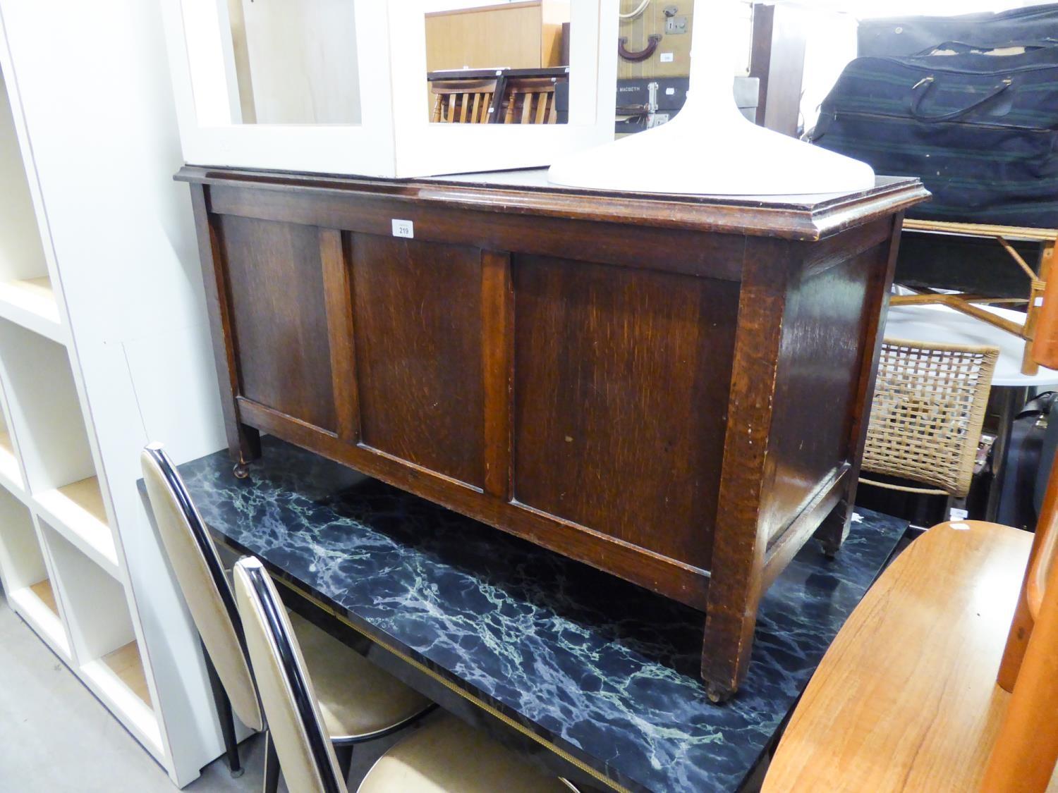 AN OAK AND PLY PANEL BLANKET CHEST WITH FRAMED THREE PANEL FRONT, CIRCA 1934