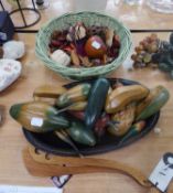 16 CARVED AND STAINED WOOD MODELS OF FRUIT AND VEGETABLES ON AN OVAL WOODEN FISH PLATTER WITH