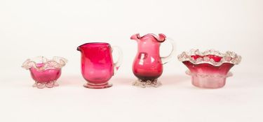 TWO SMALL CRANBERRY GLASS JUGS, with clear glass handles and bases, also  TWO CRANBERRY AND CLEAR