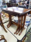 A NEST OF THREE MAHOGANY COFFEE TABLES, ON SWEPT CHEVAL FEET