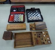 TRAVELLER'S MINIATURE CHESS AND DRAUGHTS SET, IN ZIP LEATHER CLOTH CASE; A SIMILAR CHESS SET WITH