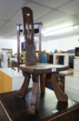 AN ADZED OAK SPINNING STOOL AND AN INLAID OAK CORNER TWO TIER TABLE