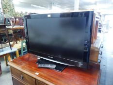 A PANASONIC 37" LCD FLAT SCREEN TV ON BASE WITH REMOTE CONTROL