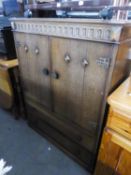 'AUSTINSUITE' OAK MILLINERY CABINET WITH TWO DOORS