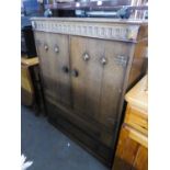 'AUSTINSUITE' OAK MILLINERY CABINET WITH TWO DOORS