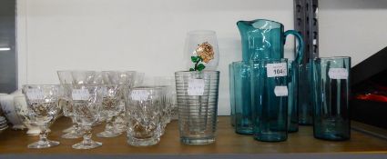 A SET OF FOUR CUT GLASS TUMBLERS,  SET OF SIX CUT GLASS WINE GOBLETS, A SMOKED GLASS WATER SET OF