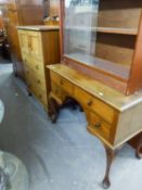 MAHOGANY TALLBOY HAVING THREE DRAWERS BELOW CUPBOARD DOOR WITH DECO STYLE HANDLES ON STUMP