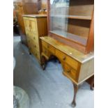 MAHOGANY TALLBOY HAVING THREE DRAWERS BELOW CUPBOARD DOOR WITH DECO STYLE HANDLES ON STUMP