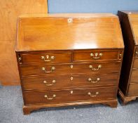 GEORGE III MAHOGANY BUREAU, of typical form, the interior fitted with short drawers and pigeon holes