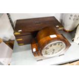 A NINETEENTH CENTURY BRASS BOUND MAHOGANY WRITING SLOPE AND A 1930's OAK MANTEL CLOCK  (2)