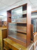 GIBBS BOOKCASE, HAVING TWO SECTIONS WITH GLASS SLIDING DOORS