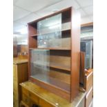 GIBBS BOOKCASE, HAVING TWO SECTIONS WITH GLASS SLIDING DOORS