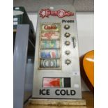 A PAINTED WOODEN FAUX CANNED DRINK DISPENSING CABINET