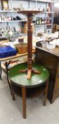 A TWO TIER CIRCULAR OCCASIONAL TABLE, AND A REPRODUCTION WOOD PEDESTAL JARDINIERE STAND (2)