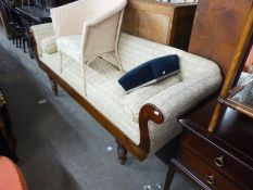 A REGENCY STYLE THREE SEATER SOFA, COVERED IN CREAM FABRIC, WITH DOUBLE ENDED OAK FRAME AN RAISED ON