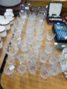 A TABLE SERVICE OF CUT GLASS, VIZ A SET OF 6 CUT GLASS SMALL BRANDY BALLOONS, 6 MATCHING STEM WINES,