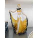 WADE STYLE ART DECO POTTERY FIGURE OF A DANCING GIRL, HOLDING OUT THE HEM OF HER DRESS