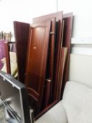 A MAHOGANY SEMI-FITTED WARDROBE IN SIMILAR TASTE ENCLOSED BY THREE MOULDED PANEL DOORS, 4?6? WIDE