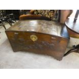 A CARVED WOODEN CAMPHOR CHEST WITH DOME TOP (SPLITS TO TOP)