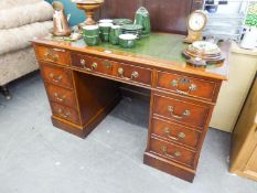 A REPRODUCTION MAHOGANY TWIN PEDESTAL DESK WITH GREEN  LEATHER INSET TOP