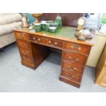 A REPRODUCTION MAHOGANY TWIN PEDESTAL DESK WITH GREEN  LEATHER INSET TOP