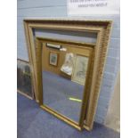 A LARGE OBLONG WALL MIRROR, IN FLORAL EMBOSSED GILT FRAME, 2?4? X 3?4? AND A LARGE EMPTY PICTURE