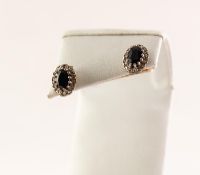 PAIR OF 9ct GOLD EARRINGS each set with a dark sapphire and a surround of eight tiny diamonds (2)