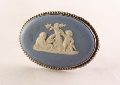 20th CENTURY WEDGWOOD PALE BLUE AND WHITE JASPER WARE OVAL BROOCH, in silver frame with beaded edge,