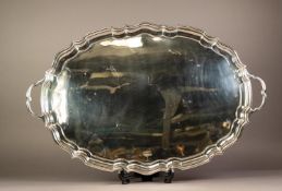 GEORGE V SILVER LARGE TWO HANDLED TEA TRAY BY CHARLES BOYTON & SON, of oval form with plain