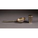 FAR EASTERN SILVER COLOURED METAL TEA STRAINER, the bowl repousse with figures, the straight