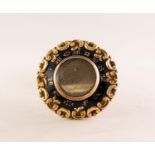 VICTORIAN GOLD AND BLACK ENAMELLED CIRCULAR BROOCH with glazed hair locket to the front, the black