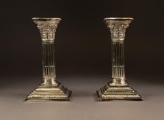 PAIR OF ELECTROPLATED CORINTHIAN COLUMN CANDLESTICKS, each with stop fluted column and stepped,