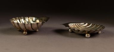 TWO SIMILAR EARLY TWENTIETH CENTURY SILVER SHELL PATTERN BUTTER DISHES both with ball feet,