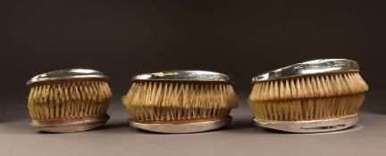 TWO PAIRS OF ENGINE TURNED SILVER BACKED MILITARY HAIRBRUSHES, together with a CHILD?S PAIR, (6)