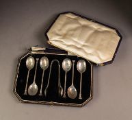 GEORGE V CASED SET OF SIX SILVER SEAL TOP TEASPOONS AND THE MATCHING PAIR OF SUGAR TONGS, case a/